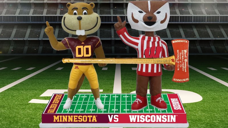 Standing side-by-side on a football field base that reads “MINNESOTA VS WISCONSIN” across the...