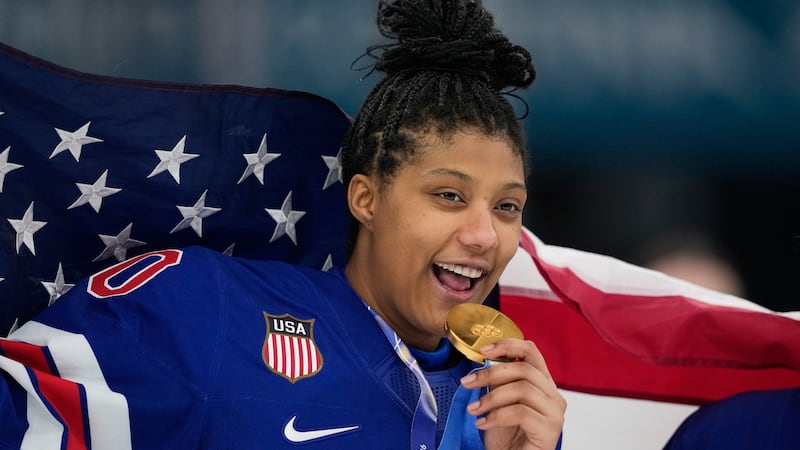 FILE - United States' Laila Edwards (10) poses after the United States' women's ice hockey...