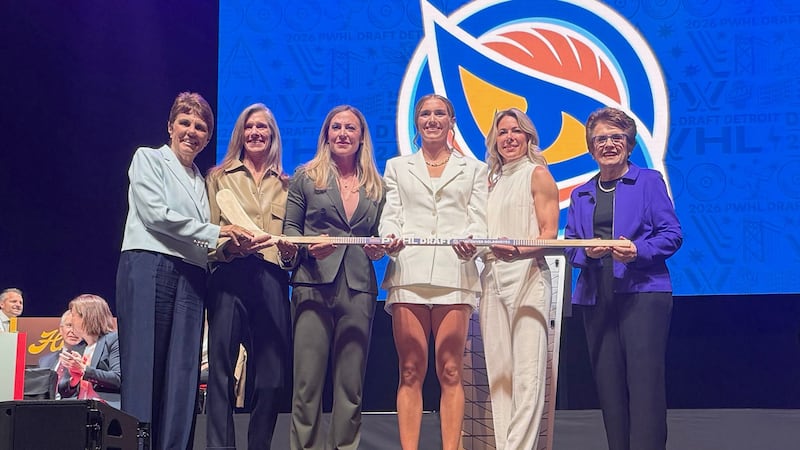 Wisconsin defender Caroline Harvey, center right, who was selected by the Vancouver Goldeneyes...