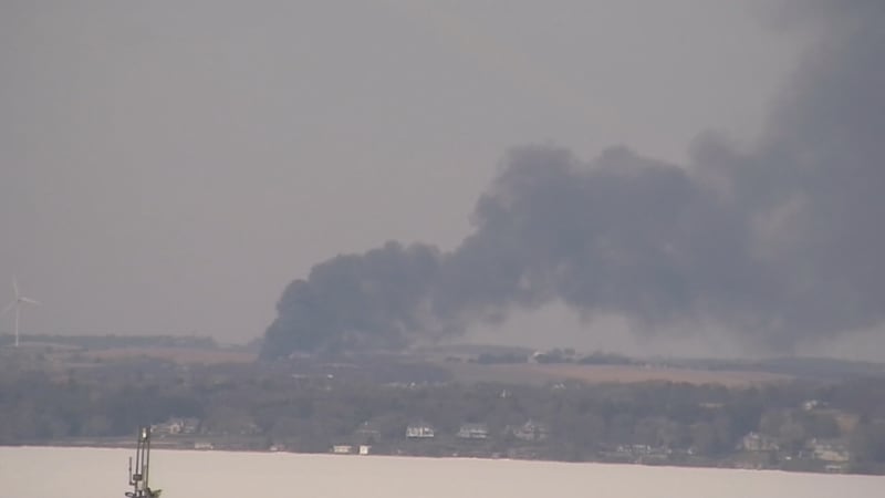 A plume of smoke is visible over Lake Mendota.