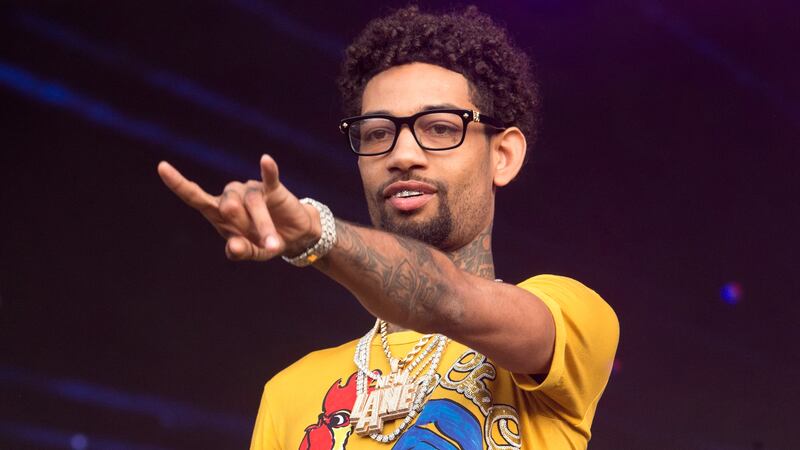 Father, teenage son charged in killing of rapper PnB Rock