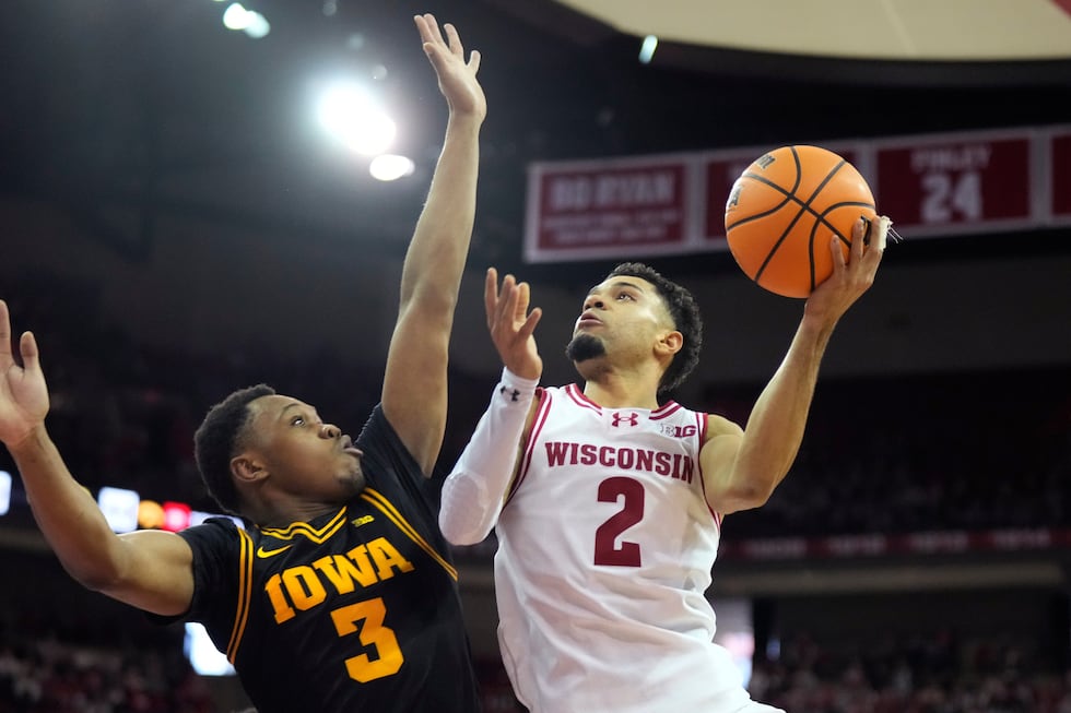 Wisconsin guard Nick Boyd (2) scores against Iowa forward Cam Manyawu (3) during the second...