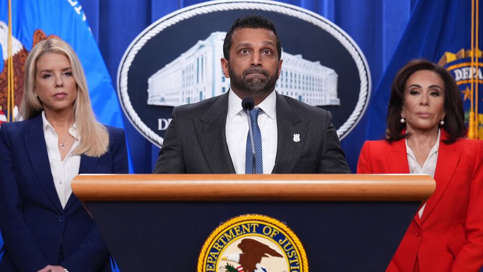 FBI Director Kash Patel, flanked by Attorney General Pam Bondi, left, and Jeanine Pirro, U.S....