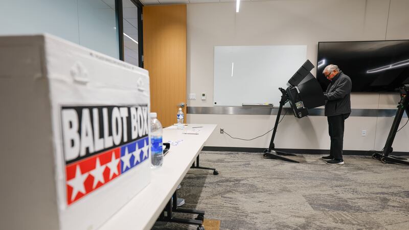A voter casts a ballot during early voting in Waukesha, Wis., Tuesday, March 18, 2025. (AP...